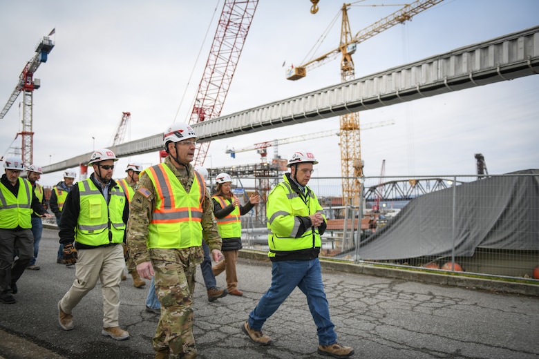 Lt. Gen. William (Butch) Graham, commanding general of the U.S. Army Corps of Engineers and 56th chief of engineers, walks with Tommy Long, resident engineer for the Nashville District, during a visit to the Chickamauga Lock on Dec. 19, 2024, in Chattanooga, Tennessee, along the Tennessee River.