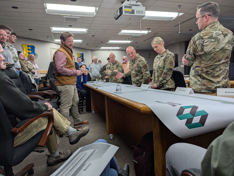 Team members from the U.S. Army Corps of Engineers. Omaha District, the 28th Bomb Wing, Air Force Global Strike Command, and the commercial construction project management team participate in a rehearsal of concept drill at Ellsworth Air Force Base, S.D., Dec. 3, 2024. The exercise focused on planning the temporary relocation of B-1B Lancer bombers and personnel to Grand Forks Air Force Base, N.D., as part of a $129.5 million runway replacement project. (U.S. Army photo by Andrew Nystrom)