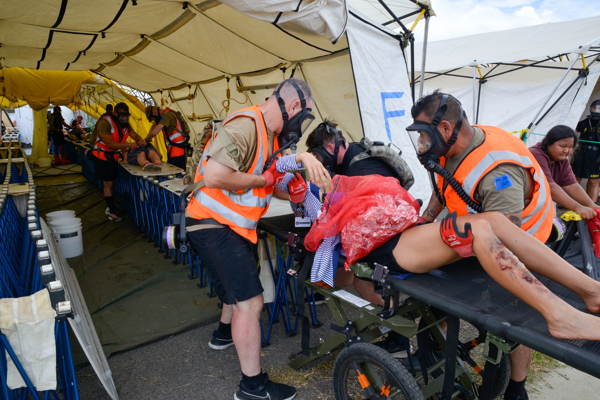 Soldiers from the California Army National Guard transport a casualty to go through decontamination during a Homeland Response Force exercise in Oahu, Hawaii, Aug. 26, 2024.