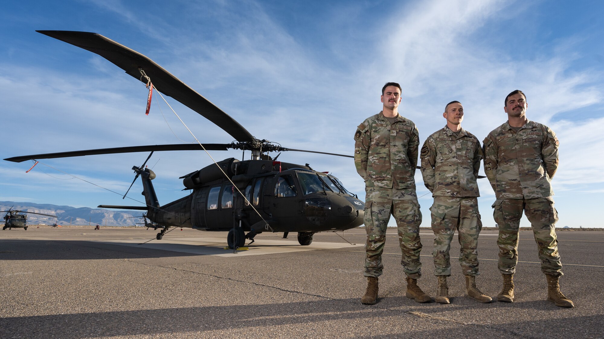 U.S. Air Force Senior Airman Joshua Ricchio, 49th Equipment Maintenance Squadron inspection journeyman, left, Airman 1st Class Ian Priestly, 49th Communication Squadron network technician, center, and U.S. Air Force Senior Airman Andrew Byorth, 49th EMS inspection journeyman, right, pose for a photo at Holloman Air Force Base, New Mexico, Dec 17. 2024. Each Airman achieved a milestone of grit and excellence, earning the coveted Air Assault badge after conquering the U.S. Army Air Assault School at Fort Campbell, Kentucky. (U.S. Air Force photo by Senior Airman Antonio Salfran)