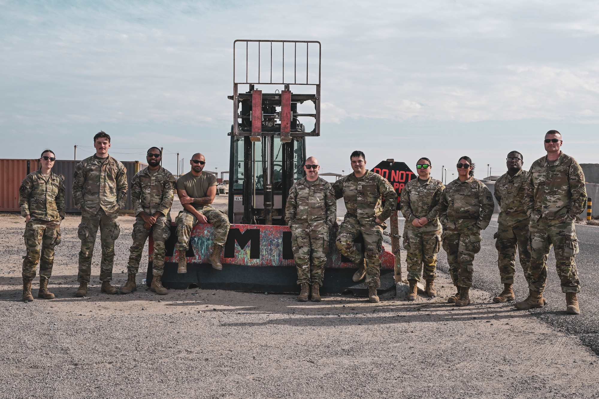 A group of people in uniform pose for a group photo.