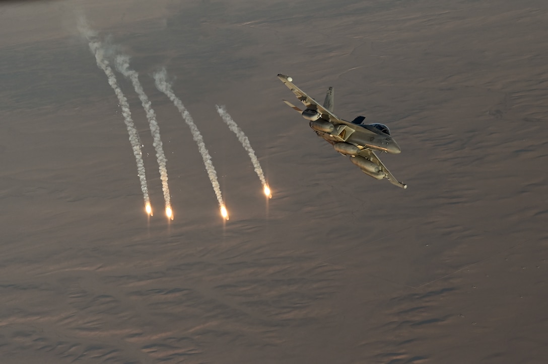 A Navy EA-18G Growler fires flares during an Operation Inherent Resolve mission over the U.S. Central Command area of responsibility, Dec. 24, 2024.