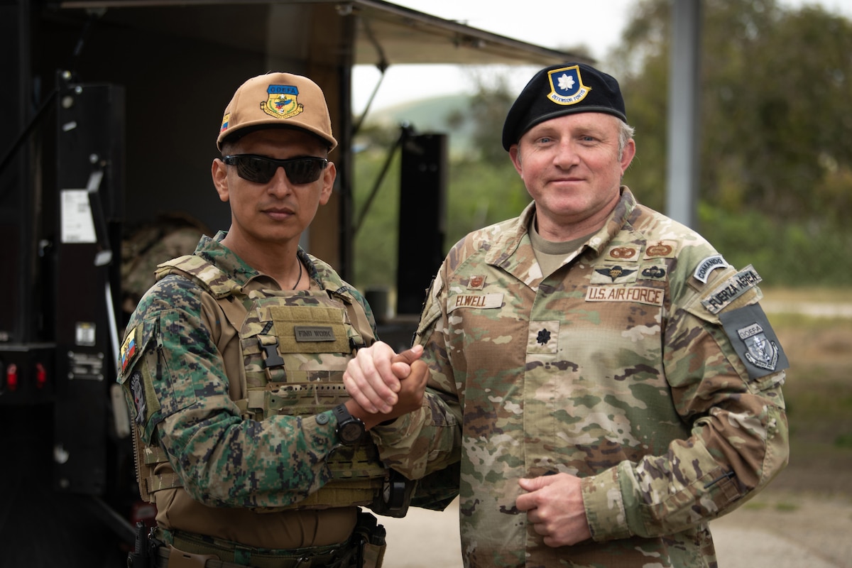 Lt. Col. Joshua Elwell, right, commander of the Kentucky Air National Guard’s 123rd Security Forces Squadron, greets his counterpart from the Ecuadorian Air Force Special Operations Command during an information exchange event at Camp San Luis Obispo, Calif., May 17, 2024. The exchange, which focused on providing military assistance to civilian law enforcement, was held under the auspices of the National Guard Bureau’s State Partnership Program, which pairs foreign military allies with National Guard units across the United States for mutual exchange of information and cooperation over a broad range of civil and military affairs. (U.S. Air National Guard photo by Tech. Sgt. Chloe Ochs)