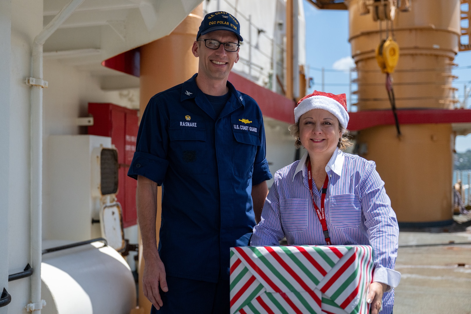 U.S. Coast Guard Capt. Jeffrey Rasnake, commanding officer, U.S. Coast Guard Cutter Polar Star (WAGB 10), and Consul General Christine Elder stand for a photo at Royal Australian Naval Base HMAS Kuttabul in Sydney, Dec. 23, 2024. The Polar Star stopped in Sydney on its way to Antartica in support of Operation Deep Freeze, a joint service, inter-agency support operation for the National Science Foundation, which manages the United States Antarctic Program.  (U.S. Coast Guard photo by Petty Officer 2nd Class Briana Carter)