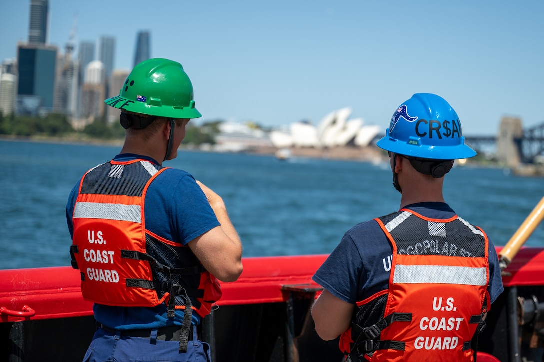 Crewmembers aboard U.S. Coast Guard Cutter Polar Star (WAGB 10) look out over Sydney Harbor while the Polar Star departs Royal Australian Naval Base HMAS Kuttabul in Sydney, Dec. 27, 2024. The Polar Star stopped in Sydney on its way to Antartica in support of Operation Deep Freeze, a joint service, inter-agency support operation for the National Science Foundation, which manages the United States Antarctic Program.  (U.S. Coast Guard photo by Petty Officer 2nd Class Briana Carter)