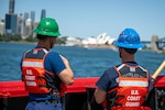 Crewmembers aboard U.S. Coast Guard Cutter Polar Star (WAGB 10) look out over Sydney Harbor while the Polar Star departs Royal Australian Naval Base HMAS Kuttabul in Sydney, Dec. 27, 2024. The Polar Star stopped in Sydney on its way to Antartica in support of Operation Deep Freeze, a joint service, inter-agency support operation for the National Science Foundation, which manages the United States Antarctic Program.  (U.S. Coast Guard photo by Petty Officer 2nd Class Briana Carter)