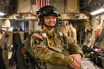 U.S. Army Reserve Staff Sgt. Tana Aley, United States Army Civil Affairs and Psychological Operations Command (Airborne), air division noncommissioned officer, stands ready during an airlift to the Sicily Drop Zone at Fort Liberty, North Carolina, Dec. 9, 2024. This year, more than 3,000 jumpers participated in Operation Toy Drop. (U.S. Air Force photo by Senior Airman Kari Degraffenreed)