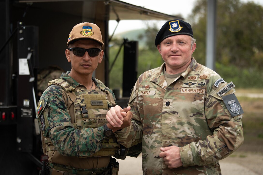 Lt. Col. Joshua Elwell, right, commander of the Kentucky Air National Guard’s 123rd Security Forces Squadron, greets his counterpart from the Ecuadorian Air Force Special Operations Command during an information exchange event at Camp San Luis Obispo, Calif., May 17, 2024. The exchange, which focused on providing military assistance to civilian law enforcement, was held under the auspices of the National Guard Bureau’s State Partnership Program, which pairs foreign military allies with National Guard units across the United States for mutual exchange of information and cooperation over a broad range of civil and military affairs. (U.S. Air National Guard photo by Tech. Sgt. Chloe Ochs)