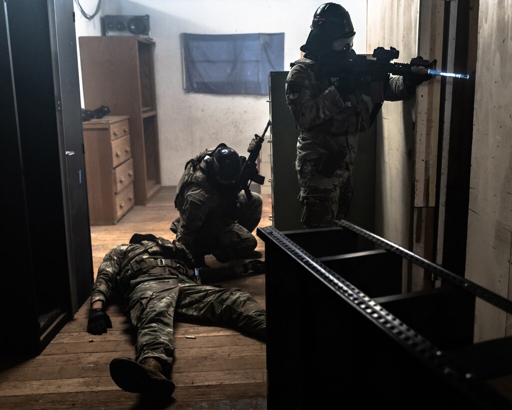 Members of the Kentucky Air National Guard’s 123rd Security Forces Squadron demonstrate room-clearing techniques at Camp San Luis Obispo, Calif., May 20, 2024, as part of an information exchange between 27 Kentucky Guard Airmen and six Ecuadorian special forces. The event, which focused on providing military assistance to civilian law enforcement, was held under the auspices of the National Guard Bureau’s State Partnership Program, which pairs foreign military allies with National Guard units across the United States for mutual exchange of information and cooperation over a broad range of civil and military affairs. (U.S. Air National Guard photo by Tech. Sgt. Chloe Ochs)