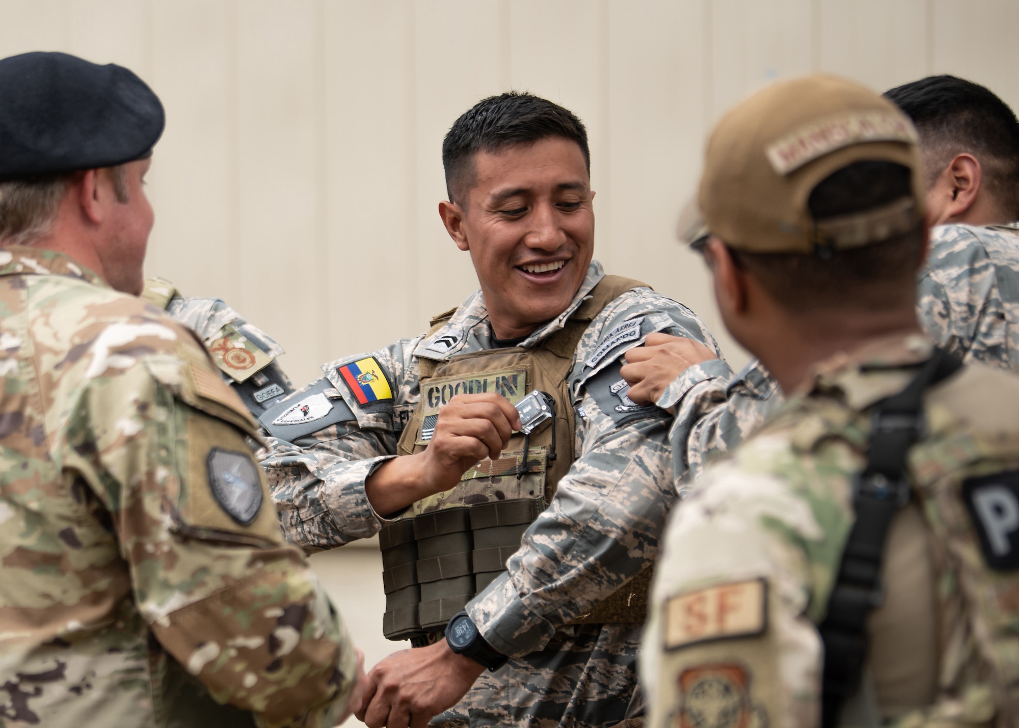 Members of the Kentucky Air National Guard’s 123rd Security Forces Squadron exchange patches with their partners from the Ecuadorian Air Force Special Operations Command during an information exchange between the two groups at Camp San Luis Obispo, Calif., May 17, 2024. The event, which focused on providing military assistance to civilian law enforcement, was held under the auspices of the National Guard Bureau’s State Partnership Program, which pairs foreign military allies with National Guard units across the United States for mutual exchange of information and cooperation over a broad range of civil and military affairs. (U.S. Air National Guard photo by Tech. Sgt. Chloe Ochs)
