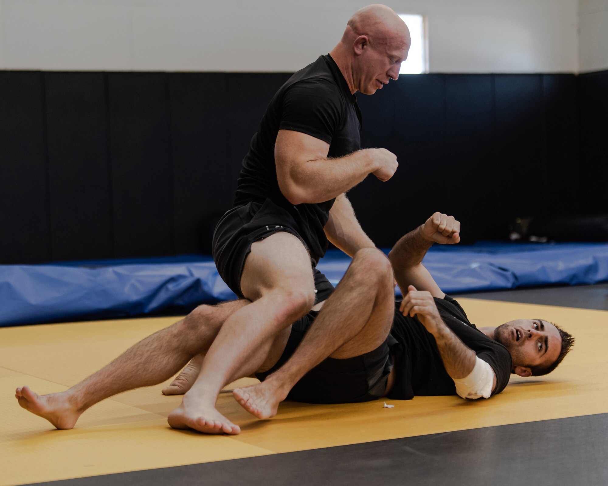 Members of the Kentucky Air National Guard’s 123rd Security Forces Squadron demonstrate hand-to-hand combatives at Camp San Luis Obispo, Calif., May 21, 2024, as part of an information exchange between 27 Kentucky Guard Airmen and six Ecuadorian special forces. The event, which focused on providing military assistance to civilian law enforcement, was held under the auspices of the National Guard Bureau’s State Partnership Program, which pairs foreign military allies with National Guard units across the United States for mutual exchange of information and cooperation over a broad range of civil and military affairs. (U.S. Air National Guard photo by Tech. Sgt. Chloe Ochs)