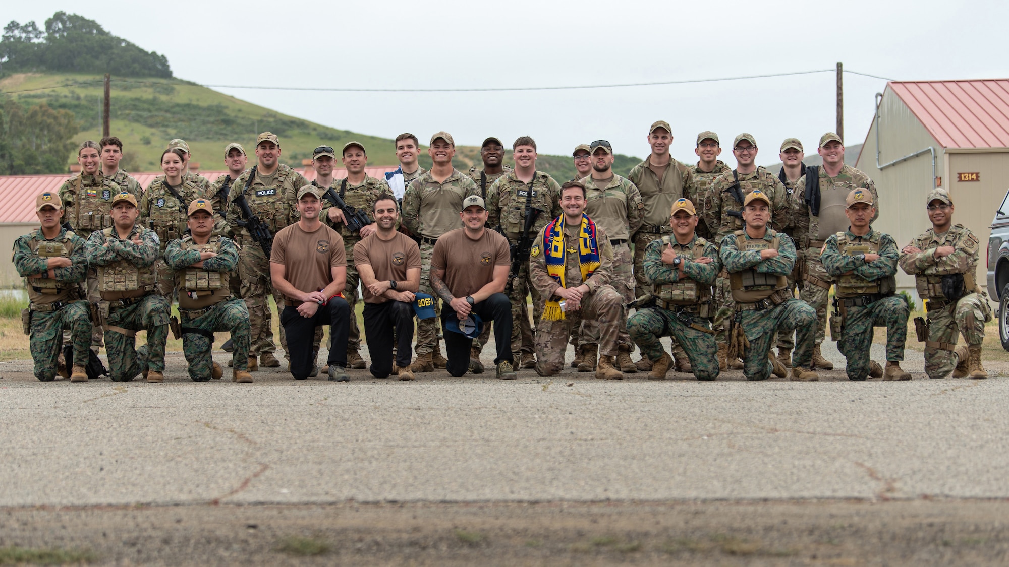Members of the Kentucky Air National Guard’s 123rd Security Forces Squadron pose for a photo with a team from the Ecuadorian Air Force Special Operations Command as part of an information exchange event between the two groups at Camp San Luis Obispo, Calif., May 20, 2024. The event, which focused on providing military assistance to civilian law enforcement, was held under the auspices of the National Guard Bureau’s State Partnership Program, which pairs foreign military allies with National Guard units across the United States for mutual exchange of information and cooperation over a broad range of civil and military affairs. (U.S. Air National Guard photo by Tech. Sgt. Chloe Ochs)