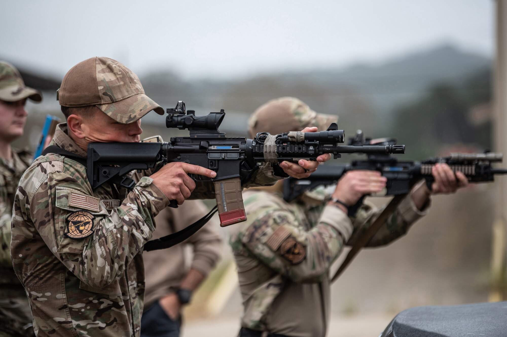 Members of the Kentucky Air National Guard’s 123rd Security Forces Squadron demonstrate vehicle interdiction techniques at Camp San Luis Obispo, Calif., May 17, 2024, as part of an information exchange between 27 Kentucky Guard Airmen and six Ecuadorian special forces Airmen. The event, which focused on providing military assistance to civilian law enforcement, was held under the auspices of the National Guard Bureau’s State Partnership Program, which pairs foreign military allies with National Guard units across the United States for mutual exchange of information and cooperation over a broad range of civil and military affairs. (U.S. Air National Guard photo by Tech. Sgt. Chloe Ochs)
