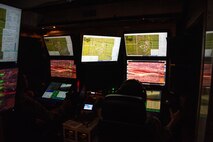 An MQ-9 pilot and sensor operator participate in exercise