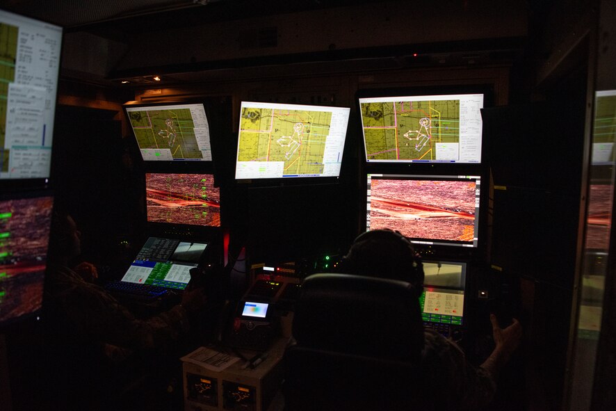 An MQ-9 pilot and sensor operator participate in exercise