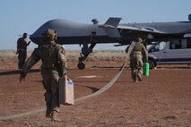 Airmen refuel an MQ-9 Reaper
