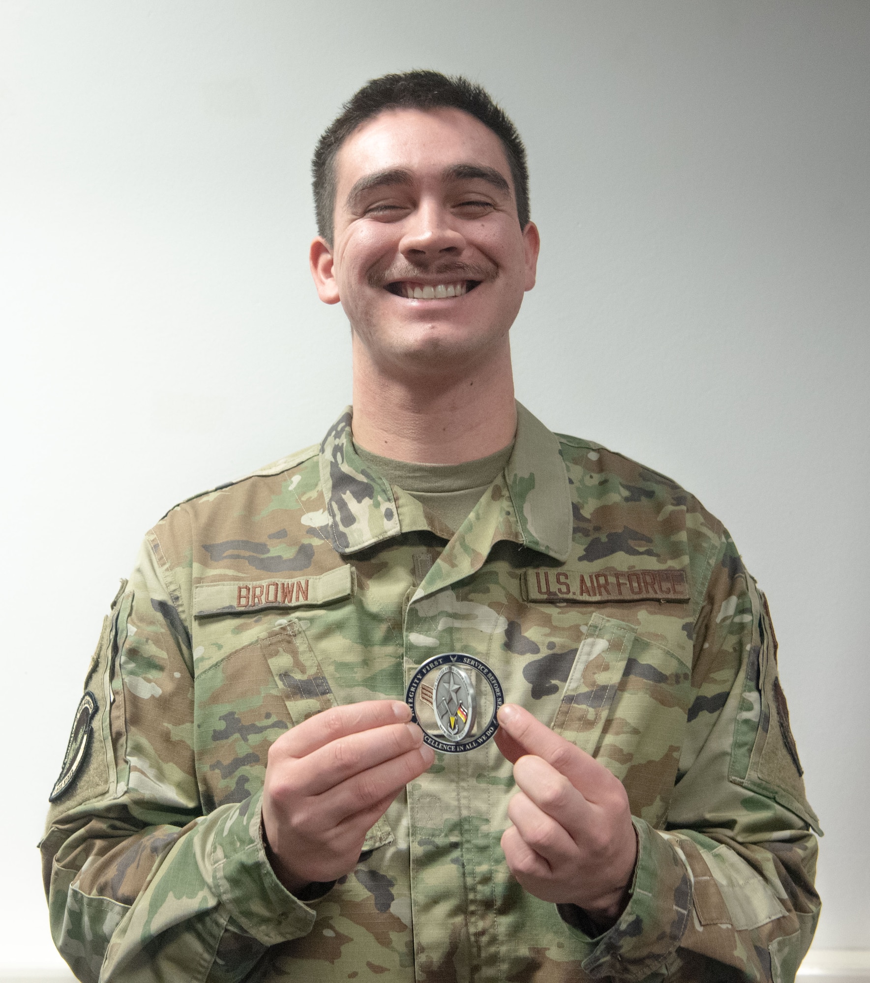 man holds coin