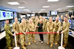 U.S. Army Maj. Gen. Bret Daugherty, center left, the adjutant general for Washington, and Liz Larter, center right, deputy chief of staff and district director for Rep. Marilyn Strickland, cut the ribbon on the newly renovated Western Air Defense Sector Agile Operations Center at Joint Base Lewis-McChord, Washington, Jan. 26, 2024.