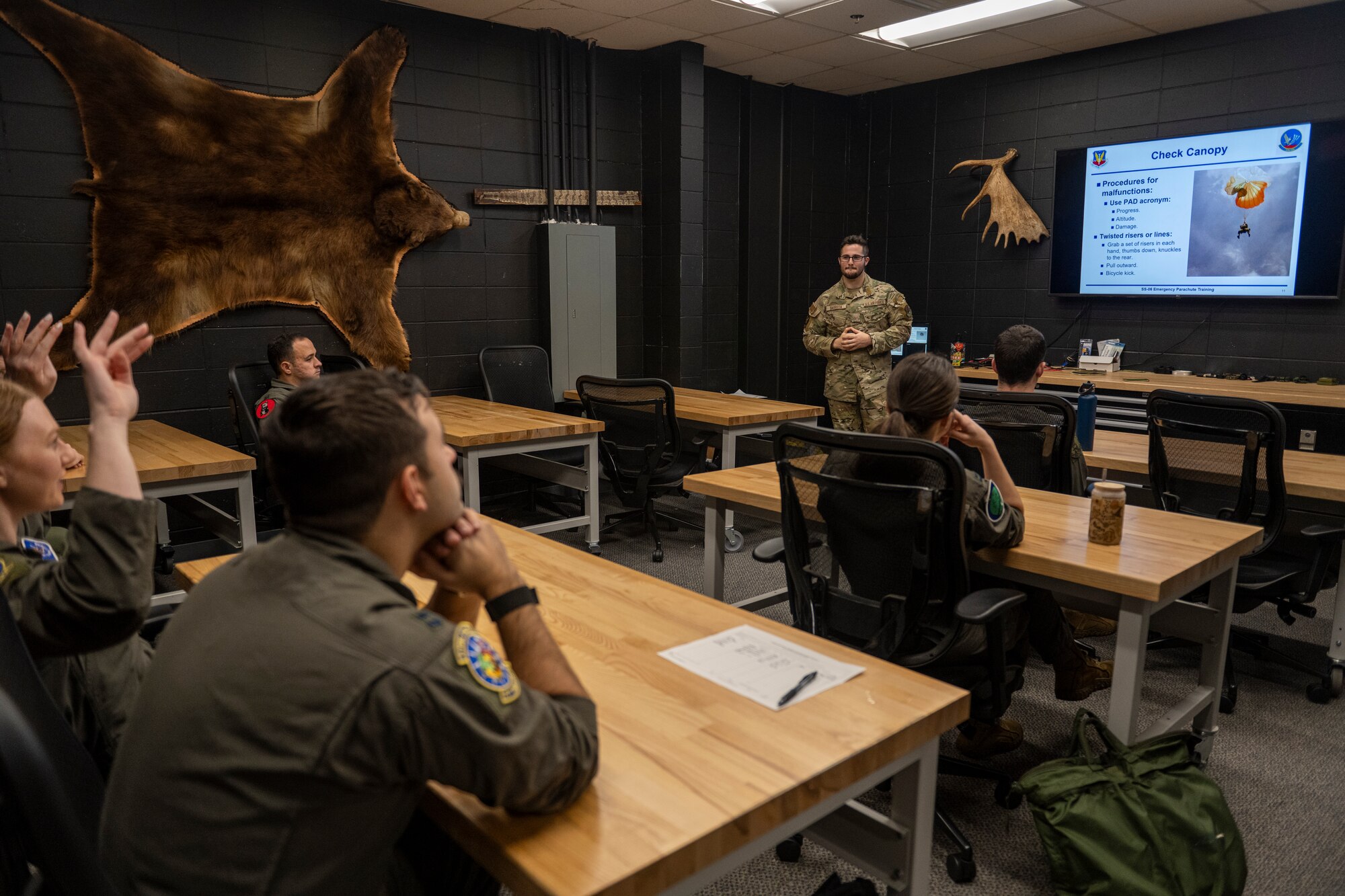 Airman participates in emergency parachute training