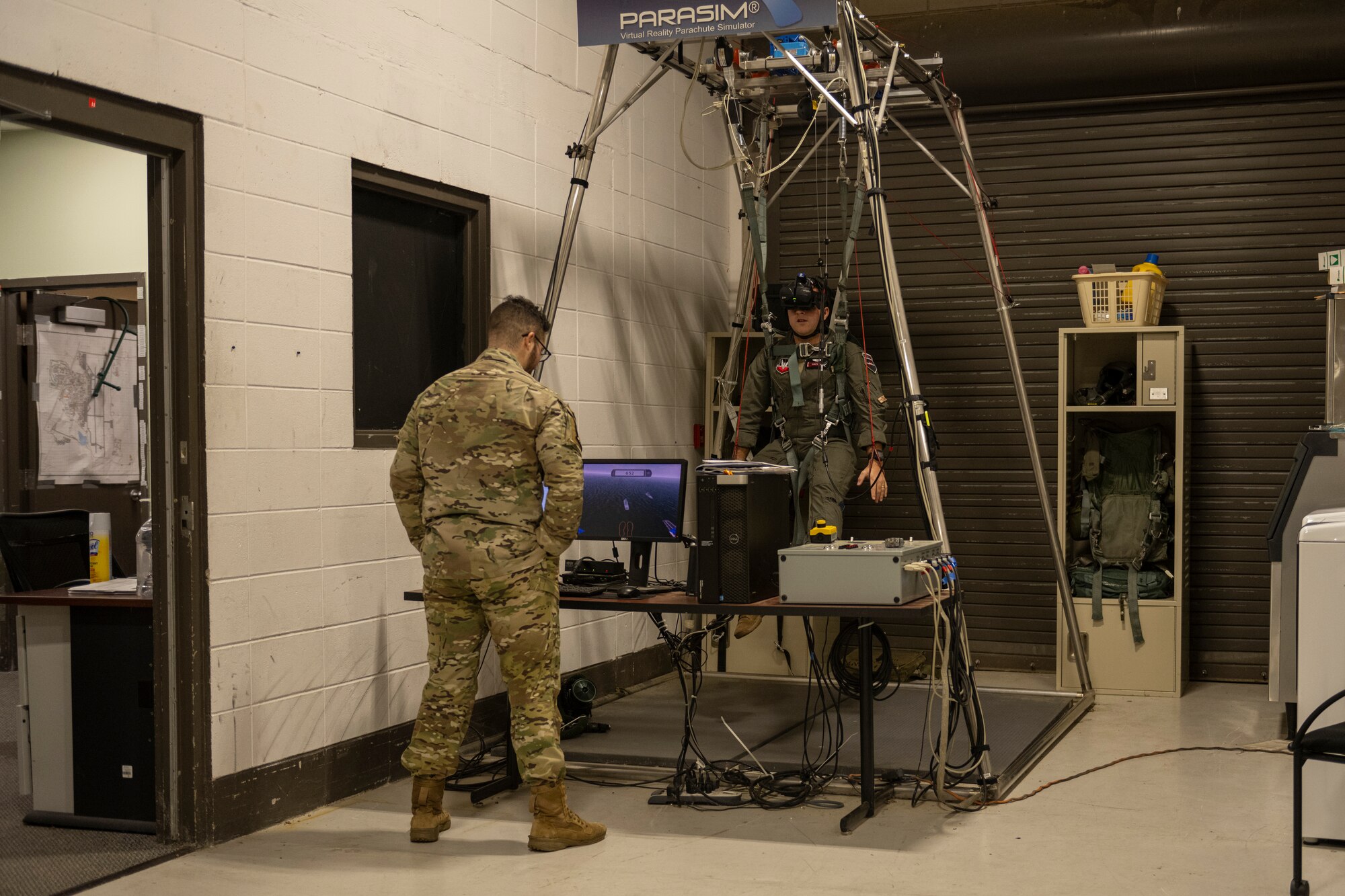 Airman tests parachute machine simulator