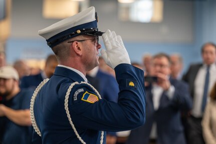 A photo of a member of the U.S. Coast Guard saluting.