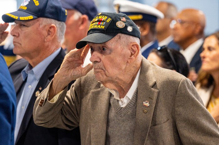 A photo of a man saluting.
