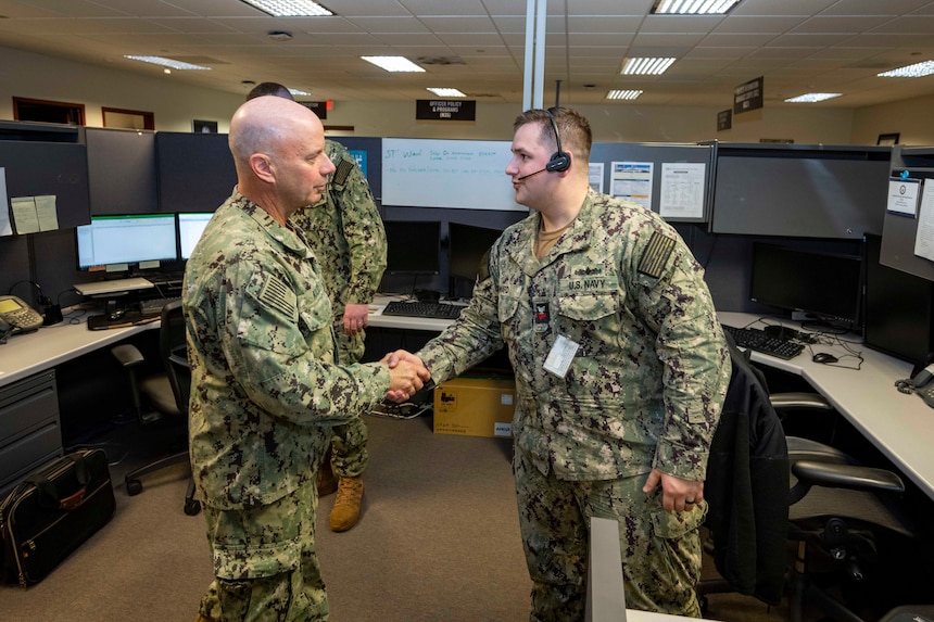 240130-N-TT671-1047 MILLINGTON, Tenn. (Jan. 30, 2024) Vice Chief of Naval Operations Adm. Jim Kilby speaks with Sonar Technician (Surface) 1st Class Austin Ward, a member of the Recruiting Operations Center (ROC) team, from Navy Recruiting Command. ROC’s goal is to streamline and remove problems in the recruitment process and enhance communication between field recruiters and headquarters staff. Kilby visited Millington to engage with Sailors and meet with leadership to discuss recruiting challenges and initiatives, and pay and personnel, and supporting our Sailors. (U.S. Navy photo by Mass Communication Specialist 2nd Class Michael Porterfield)