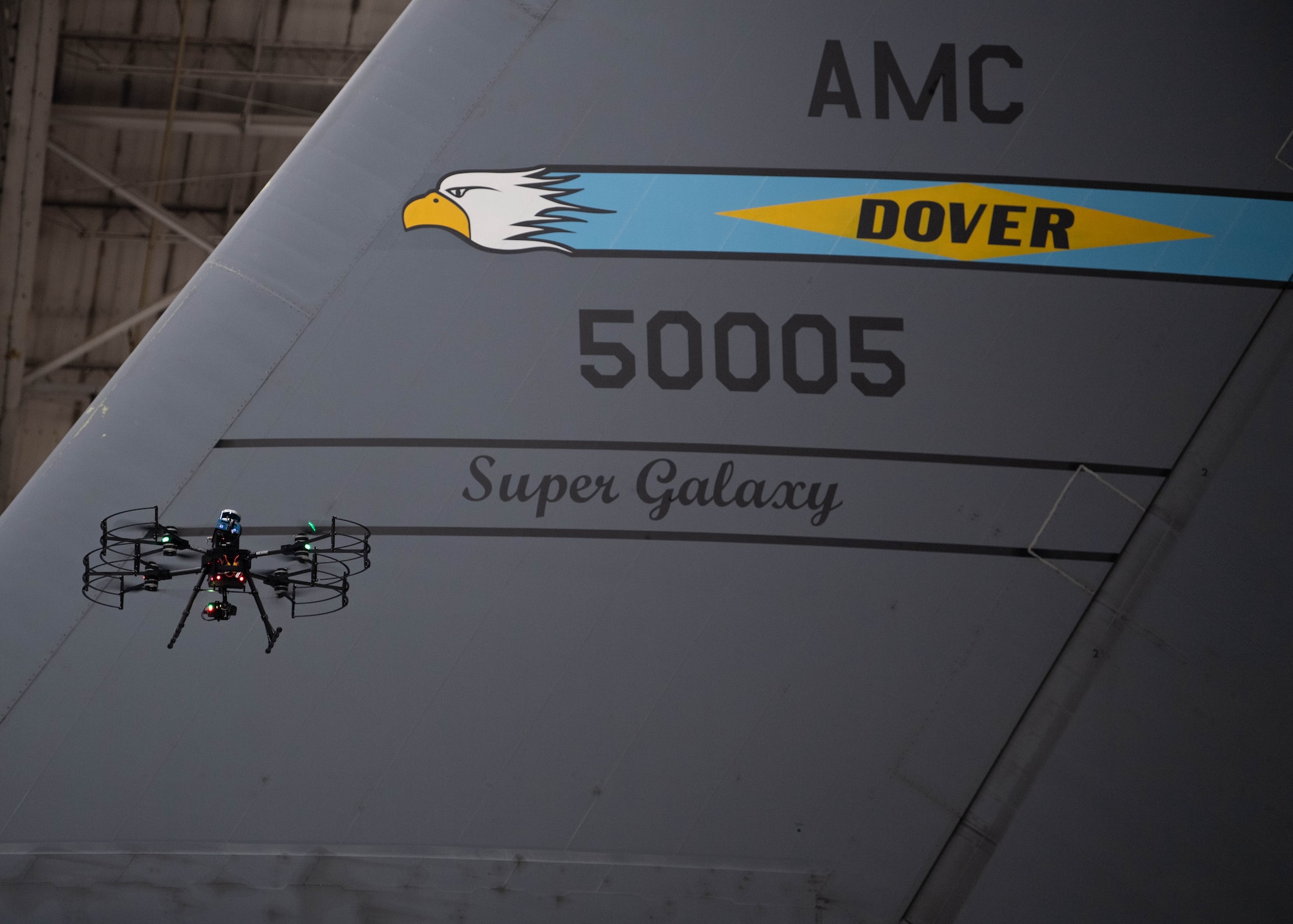 A Near Earth Autonomy drone scans a C-5M Super Galaxy at Dover Air Force Base, Delaware, January 23, 2024. Team Dover in cooperation with Boeing and Near Earth Autonomy tested a drone program for an autonomous C-5M Super Galaxy aircraft inspection project. Traditional inspections that require personnel to use a safety harness, maintenance stands, or vehicles can take hours to accomplish, but the drone can complete the same inspection in approximately 10 minutes. (U.S. Air Force photo by Tech. Sgt. J.D. Strong II)