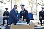 Navy Capt. Jenny Burkett, director of Naval Hospital Camp Pendleton, and retired Master Chief Petty Officer Kevin Burg, former Command Master Chief of Naval Hospital Camp Pendleton, cut a ceremonial cake on Jan. 30, 2024, in celebration of the 10-Year Anniversary of the grand opening of the current hospital held aboard Marine Corps Base Camp Pendleton.