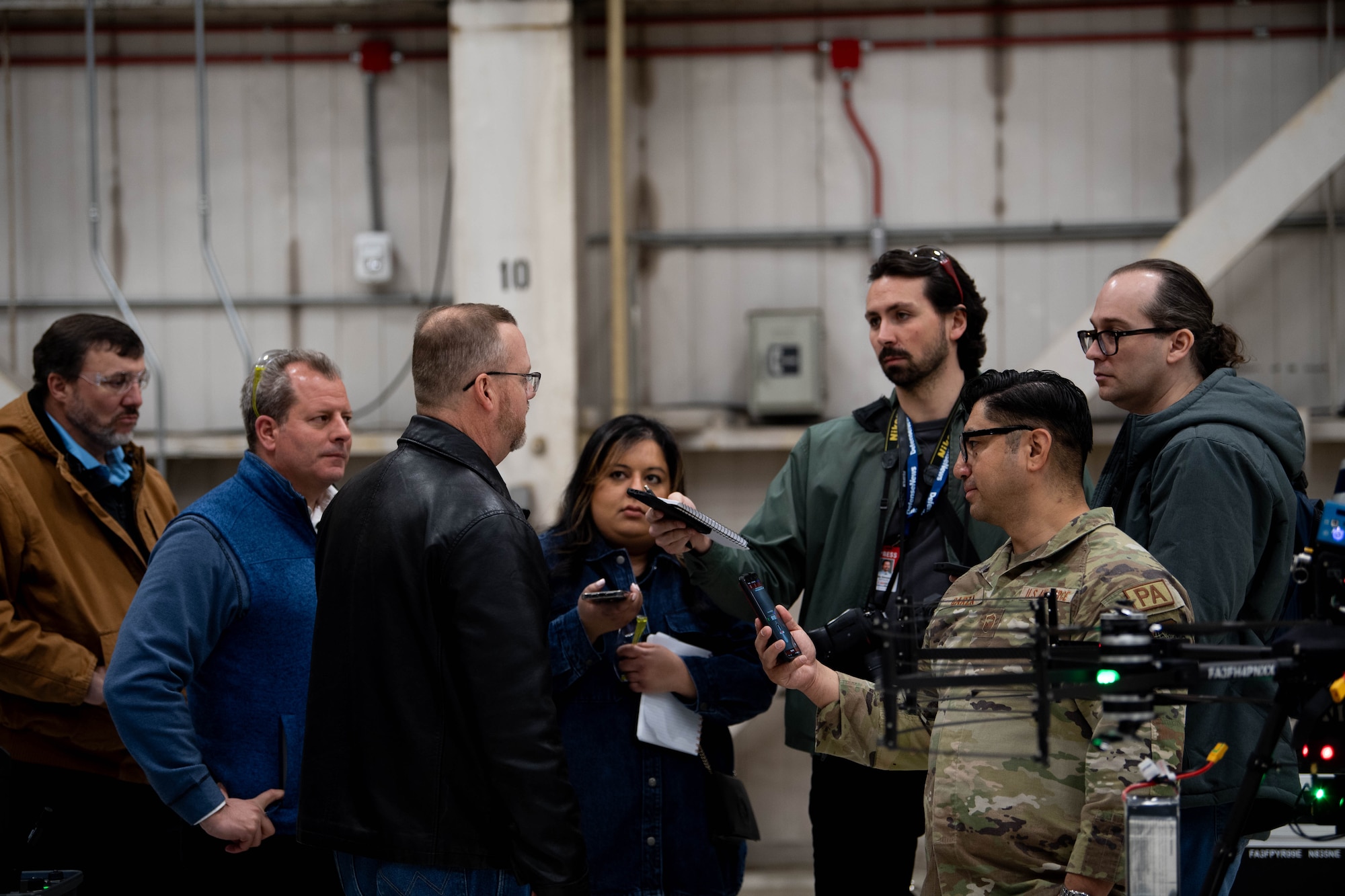 Ken Jones, 436th Mission Generation Group continuous process improvement manager, answers questions from media at Dover Air Force Base, Delaware, January 23, 2024. Team Dover in cooperation with Boeing and Near Earth Autonomy tested a drone program for an autonomous C-5M Super Galaxy aircraft inspection project. Traditional inspections that require personnel to use a safety harness, maintenance stands, or vehicles can take hours to accomplish, but the drone can complete the same inspection in approximately 10 minutes. (U.S. Air Force photo by Tech. Sgt. J.D. Strong II)