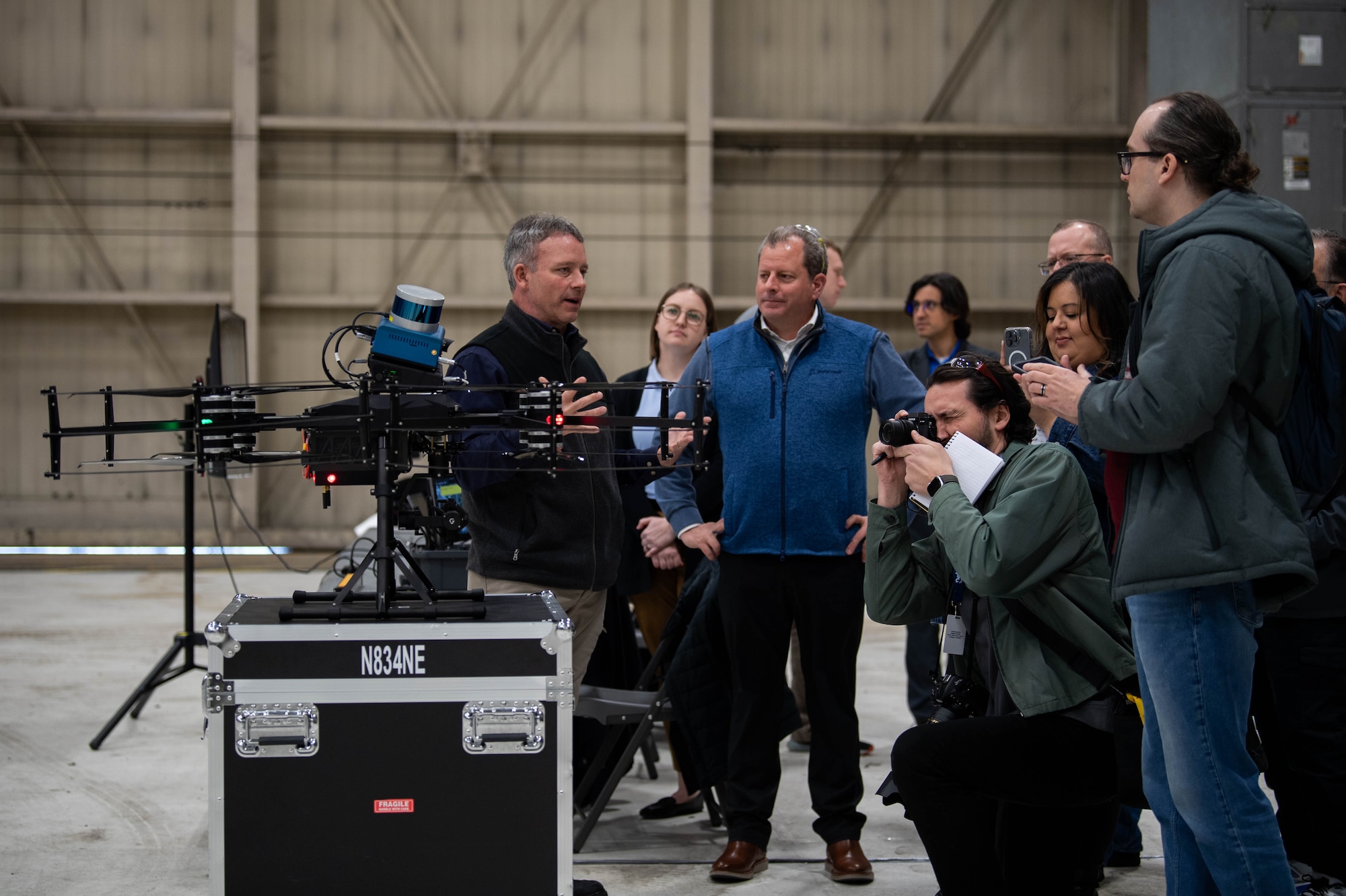 Members of Boeing and Near Earth Autonomy brief media after a drone demonstration at Dover Air Force Base, Delaware, January 23, 2024. Team Dover in cooperation with Boeing and Near Earth Autonomy tested a drone program for an autonomous C-5M Super Galaxy aircraft inspection project. Traditional inspections that require personnel to use a safety harness, maintenance stands, or vehicles can take hours to accomplish, but the drone can complete the same inspection in approximately 10 minutes. (U.S. Air Force photo by Tech. Sgt. J.D. Strong II)