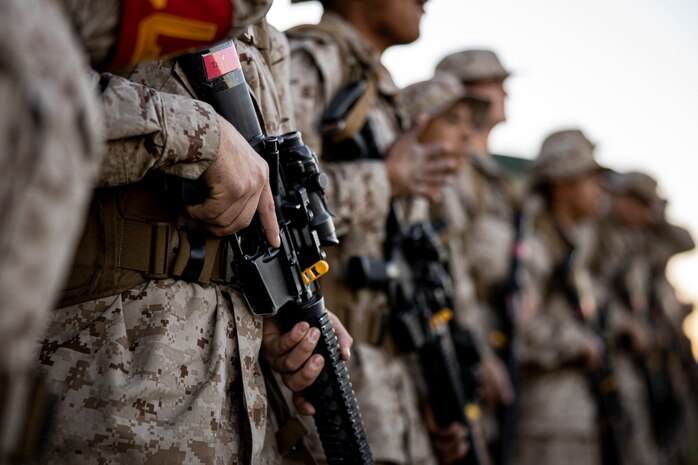 U.S. Marine Corps recruits with Delta Company, 1st Recruit Training Battalion, stand in formation during an 8-kilometer hike at Marine Corps Base Camp Pendleton, California, Jan. 30, 2024. The purpose of the hike is to condition the recruits to rigorous terrain on Camp Pendleton in preparation for their 13-kilometer hike and culminating event -- the Crucible. (U.S. Marine Corps photo by Sgt. Yvonna Guyette)