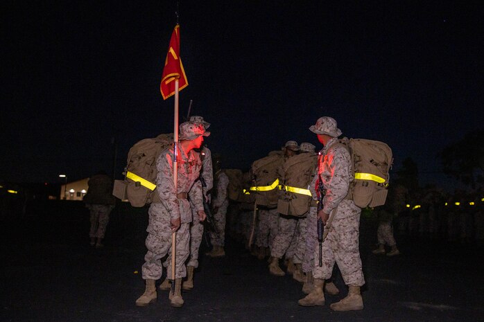 U.S. Marine Corps recruits with Delta Company, 1st Recruit Training Battalion, prepare to conduct an 8-kilometer hike at Marine Corps Base Camp Pendleton, California, Jan. 30, 2024. The purpose of the hike is to condition the recruits to rigorous terrain on Camp Pendleton in preparation for their 13-kilometer hike and culminating event -- the Crucible. (U.S. Marine Corps photo by Sgt. Yvonna Guyette)
