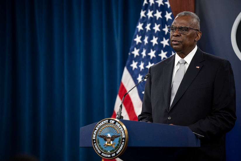 A man speaks from a podium.