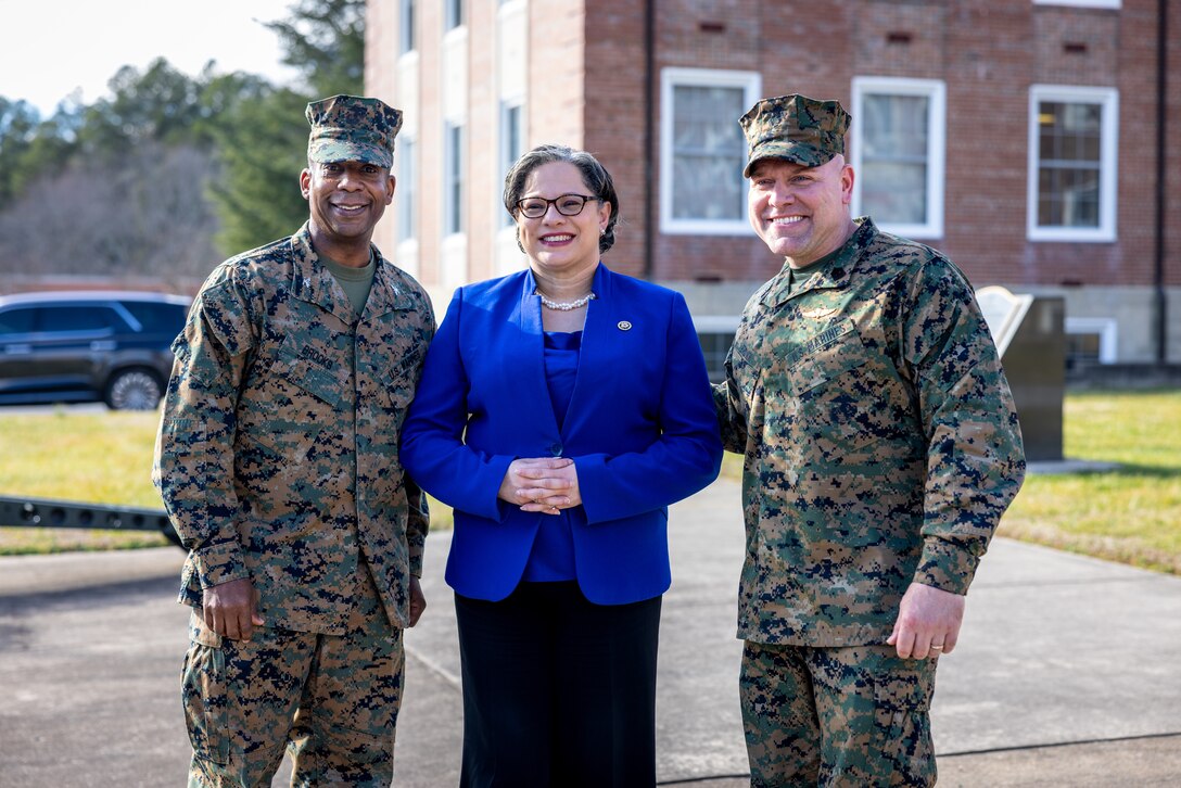 U.S. Marine Corps Col. Michael L. Brooks, commanding officer of Marine Corps Base Quantico, left, U.S. Rep. Jennifer McClellan, a U.S. representative for Virginia’s Fourth Congressional District, and Sgt. Maj. Michael R. Brown, base sergeant major, MCBQ, pose for a photo after a base tour on MCBQ, Virginia, Jan. 29, 2024. During the tour, McClellan learned about the installation, Marines’ quality of life in the barracks, and the Child Development Center. (U.S. Marine Corps photo by Lance Cpl. Joaquin Dela Torre)