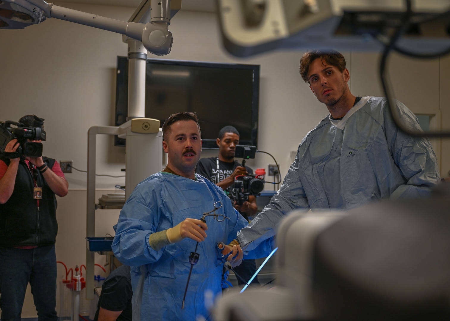 Zach Collins, San Antonio Spurs player, simulated laparoscopic surgery with Hospital Corpsman 1st Class Nicholas Althouse, Medical Education and Training Campus Surgical Technologist program instructor, Jan. 25, 2024, at METC, Joint Base San Antonio-Fort Sam Houston, TX.