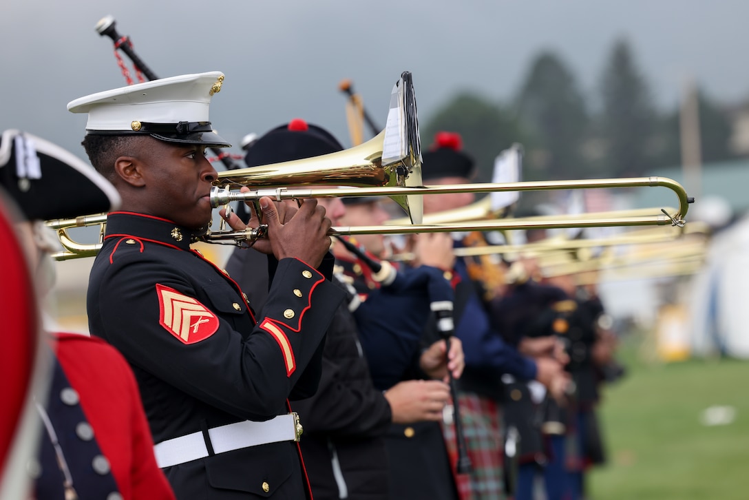 U.S. Marine Corps Sgt. Kenenna Akamelu, a trombone instrumentalist with the 1st Marine Division Band, plays the trombone at the opening ceremony of the 47th annual Longs Peak Scottish-Irish Highland Festival in Estes Park, Colorado, Sept. 10, 2023. The festival celebrates Scottish and Irish heritage through a variety of traditional athletic games, jousting competitions, music and dancing. The 1st Marine Division Band, along with other military entities, have annually performed at the festival. Akamelu is a native of Houston. (U.S. Marine Corps photo by Cpl. Daniel Medina)