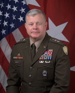 A portrait of Lieutenant General Mark T. Simerly in front of the American flag and three-star Army flag