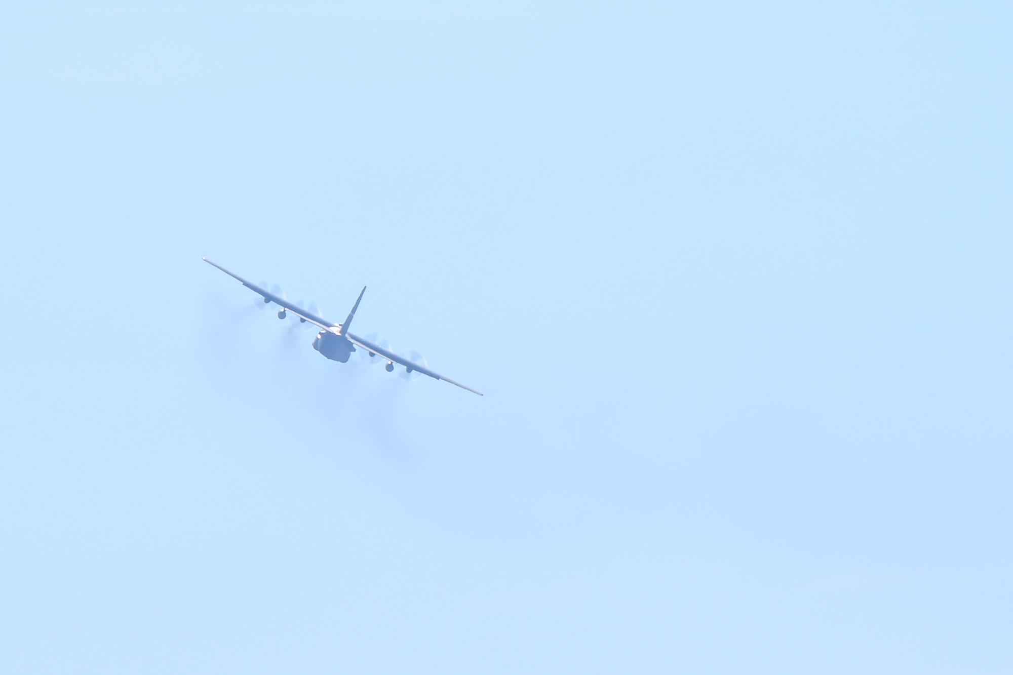 A C-130H Hercules aircraft flies away from Youngstown Air Reserve Station, Ohio, for the final time while assigned to the 910th Airlift Wing, Jan. 31, 2024.