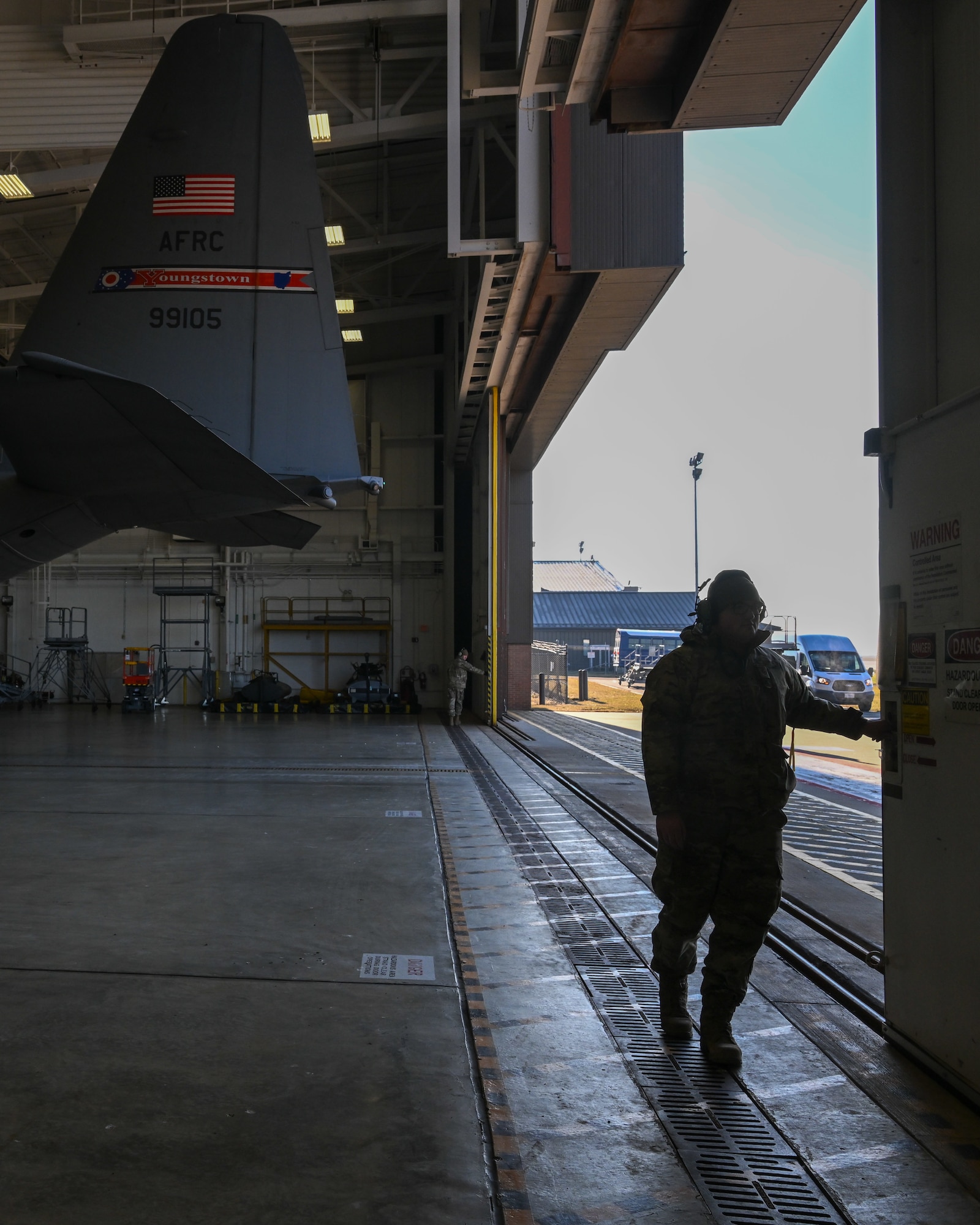 Members of the 910th Maintenance Group prepare to taxi an aircraft from a maintenance hangar to a parking spot on the aircraft ramp to begin pre-flight preparations, Jan. 31, 2024, at Youngstown Air Reserve Station, Ohio.