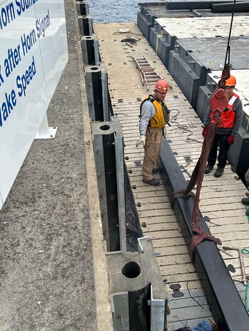Installing the HDPE walers on the guide wall.
