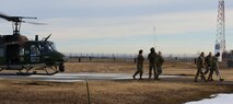 U.S. Air Force Chaplain Maj. Gen. Randall Kitchens, U.S. Air Force chief of chaplains, and U.S. Air Force Chief Master Sgt. Sadie Chambers, Religious Affairs senior enlisted advisor, exit a UH-1N Iroquois at the Missile Alert Facility Bravo-01, North Dakota, Jan. 30, 2024. As the Chief of Chaplains Board, Kitchens and his colleagues advise the secretary of Defense and the joint Chiefs of Staff on religious, ethical and quality-of-life concerns. (U.S. Air Force photo by Airman 1st Class Luis Gomez)