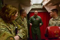 U.S. Air Force Chief Master Sgt. Sadie Chambers, Religious Affairs senior enlisted advisor, (left) and U.S. Air Force Chaplain Maj. Gen. Randall Kitchens, U.S. Air Force chief of chaplains, (center) listen to an explanation of the Launch Control Center at the Missile Alert Facility Bravo-01, North Dakota, Jan. 30, 2024. As the Chief of Chaplains, Kitchens leads the Department of the Air Force Chaplain Corps of approximately 2,100 chaplains and religious affairs Airmen from the active duty and Air Reserve components. (U.S. Air Force photo by Airman 1st Class Luis Gomez)