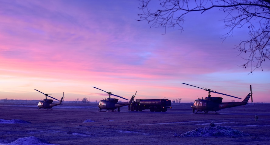 Three UH-1N Iroquois idle on Rescue Pad one as members of the 54th Helicopter Squadron prepare to fly U.S. Air Force Chaplain Maj. Gen. Randall Kitchens, U.S. Air Force chief of chaplains, and U.S. Air Force Chief Master Sgt. Sadie Chambers, Religious Affairs senior enlisted advisor, onto Missile Alert Facility Bravo-01 at Minot Air Force Base, North Dakota, Jan. 29, 2024. As the Chief of Chaplains, Kitchens leads the Department of the Air force Chaplain Corps of approximately 2,100 chaplains and religious affairs Airmen from the active duty and Air Reserve components.