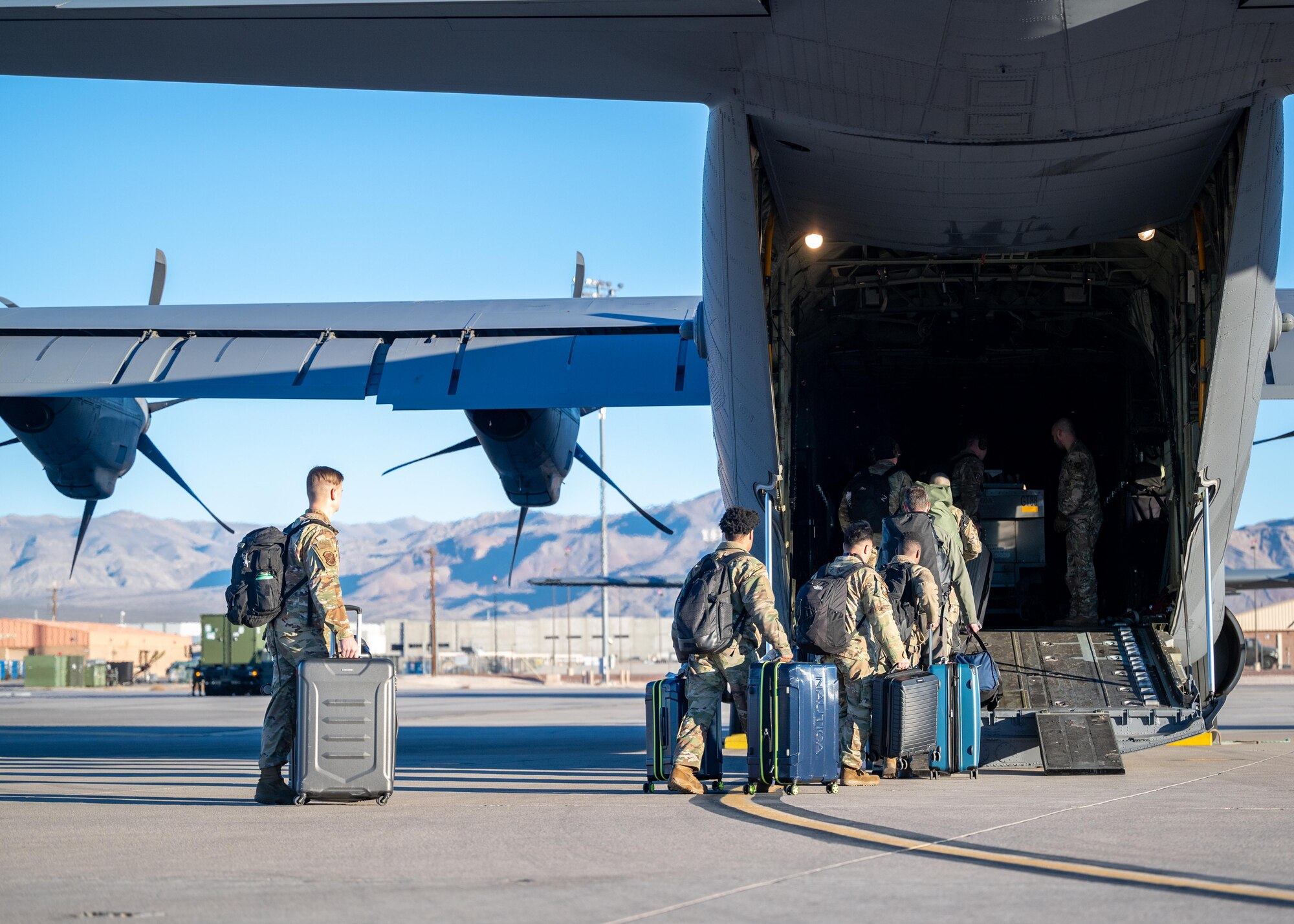 Airmen assigned to the 79th Fighter Generation Squadron board a C-130 Hercules.