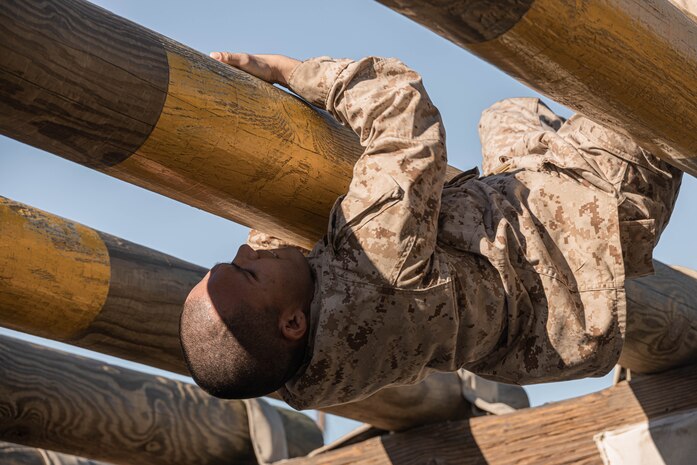 U.S. Marine Corps Recruit Ruben Velasquez Arredondo with Hotel Company, 2nd Recruit Training Battalion, maneuvers an obstacle during the confidence course at Marine Corps Recruit Depot San Diego, California, Jan. 29, 2024. The course is designed to challenge the recruits’ physical agility and mental focus by completing obstacles that require their strength, balance, and determination.  Velasquez Arredondo is native of Redwood City, California. (U.S. Marine Corps photo by Lance Cpl. Alexandra M. Earl)