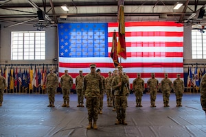 U.S. Army Soldiers stands in formation during the 1st Infantry Division Artillery Alignment Ceremony at King Field House on Fort Riley, Kansas, Jan. 19, 2024. The ceremony brought different groups together under the "DIVARTY" title for the first time. (U.S. Army photo by Spc. Mackenzie Striker)
