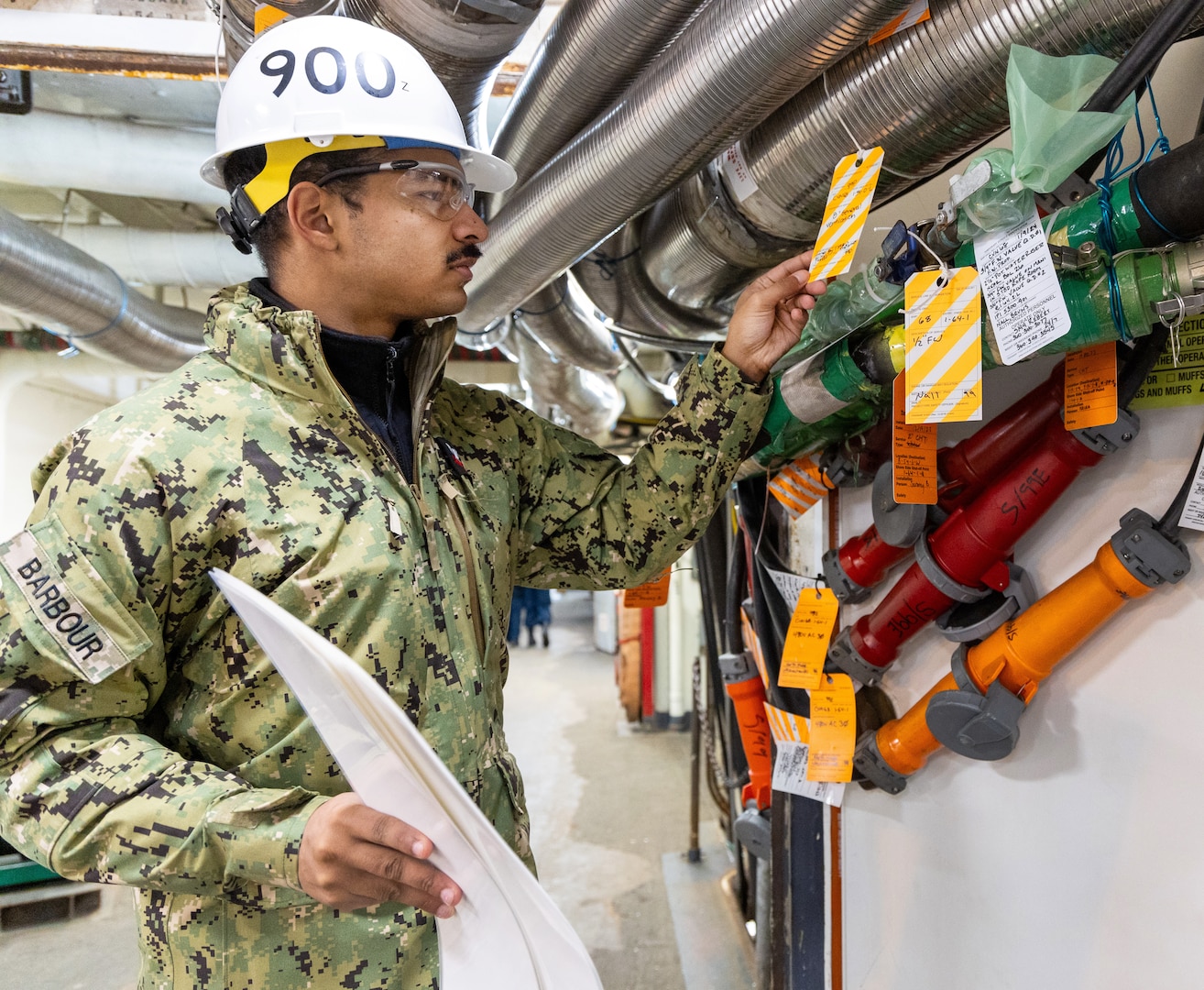 Electricians Mate First Class Lukas Barbour works aboard USS Nimitz (CVN 68) Jan. 19, 2023, during the two-week
Navy Reserve exercise "DEPLOYEX24." Barbour assisted with the implementation of 8010 REV 1 Fire Zone audit and verification of temporary services route path and optimization. 
 (U.S Navy photo by Wendy Hallmark)