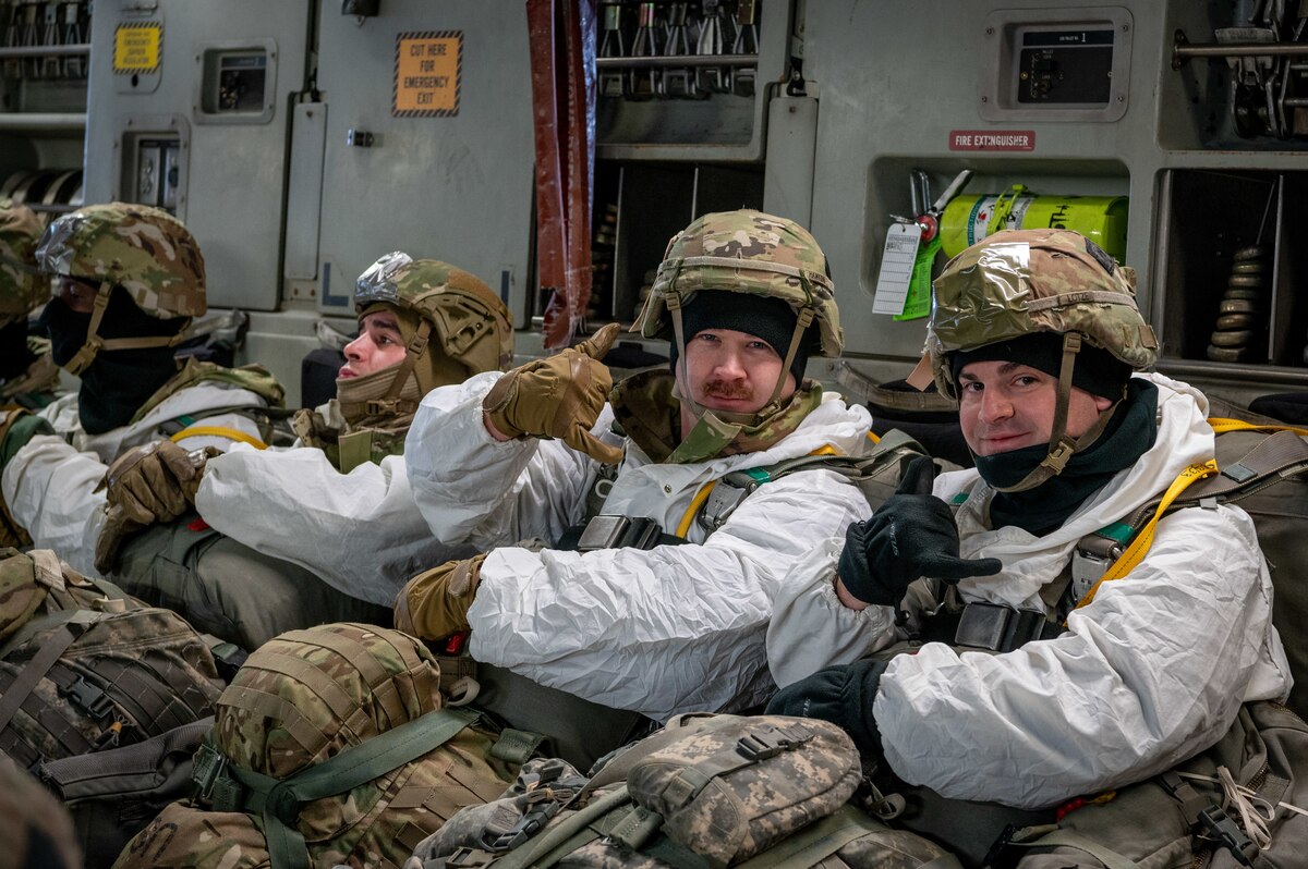 U.S. Army paratroopers of the 2nd Brigade Combat Team, 11th Airborne Division give the “hang loose” as they prepare for their jump from a C-17 Globemaster III at Joint Base Elmendorf-Richardson, Alaska, Jan. 30, 2024.