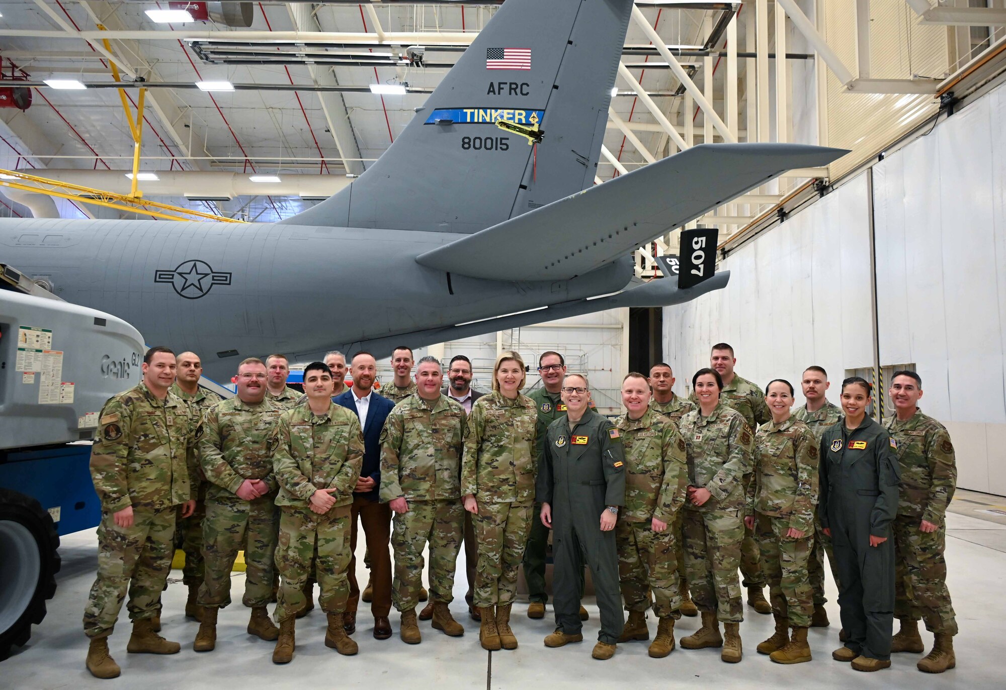 Group of people standing in front of a jet